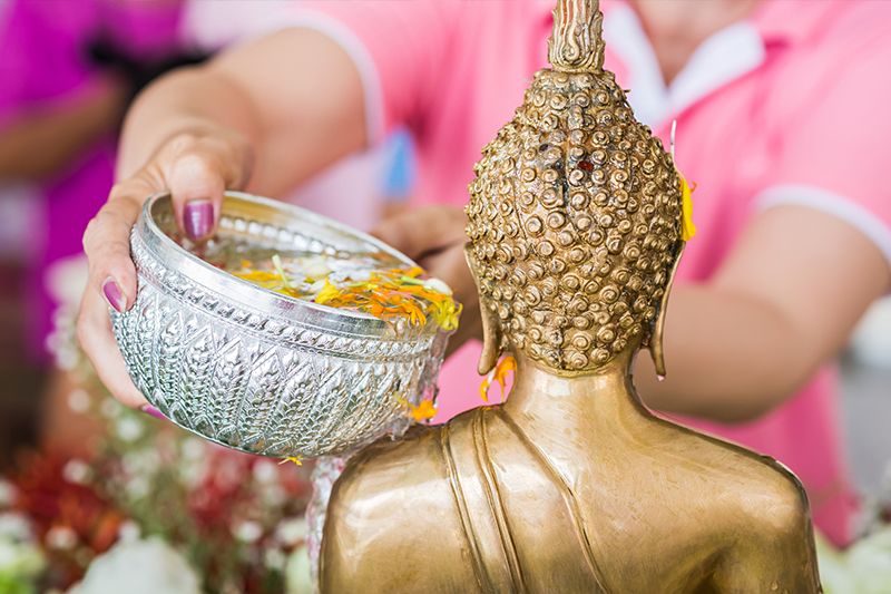 Cleansing Buddha - Songkran festival, Bangkok, Thailand