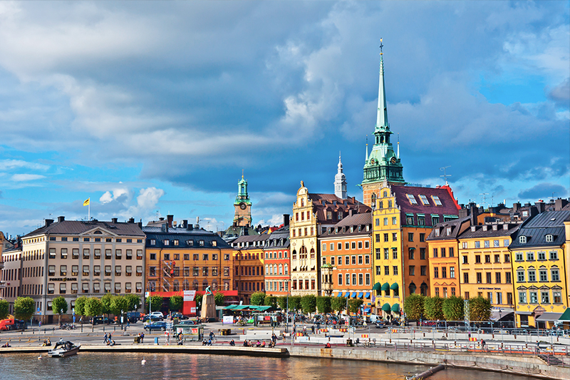 Gamla Stan - colourful buildings and harbour in Stockholm, Sweden
